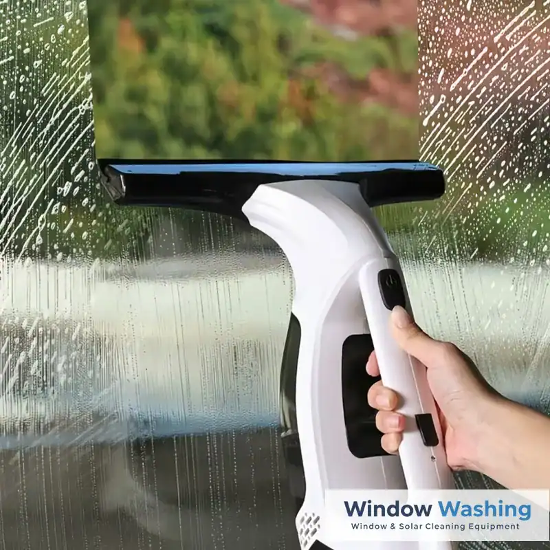 Handheld window vacuum leaving a streak-free stripe on wet glass